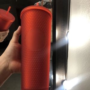 Red studded Starbucks tumbler